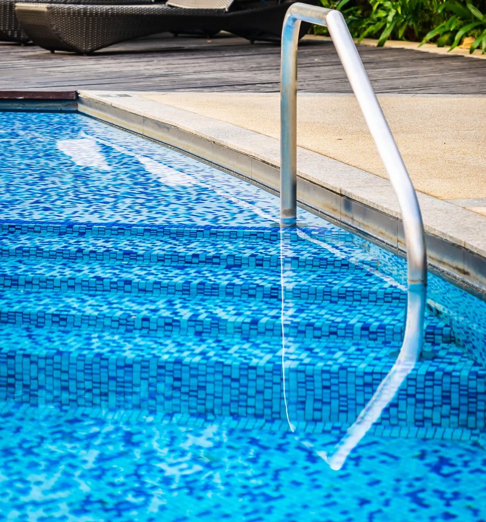 beautiful-outdoor-swimming-pool-with-bed-deck-chair-umbrella-resort-travel-vacation-min beautiful outdoor swimming pool with bed deck chair umbrella resort travel vacation min
